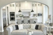 25 all-white kitchen with greys and a grey and silver living room with an open plan