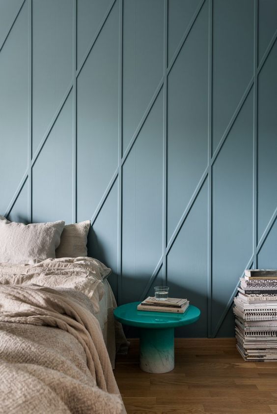 cool dusty blue wall panels with an abstract print