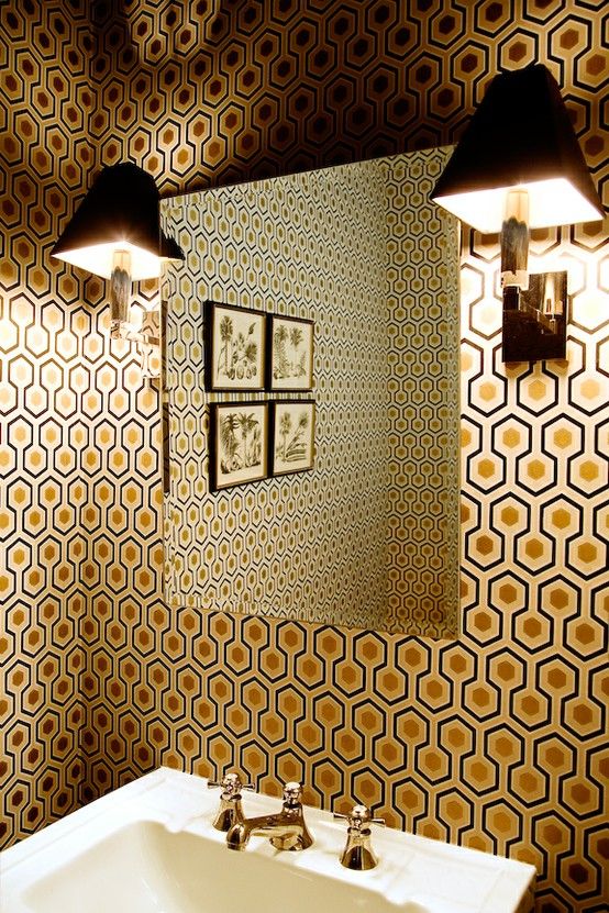 hexagon print with gold inside and retro faucets for a bathroom