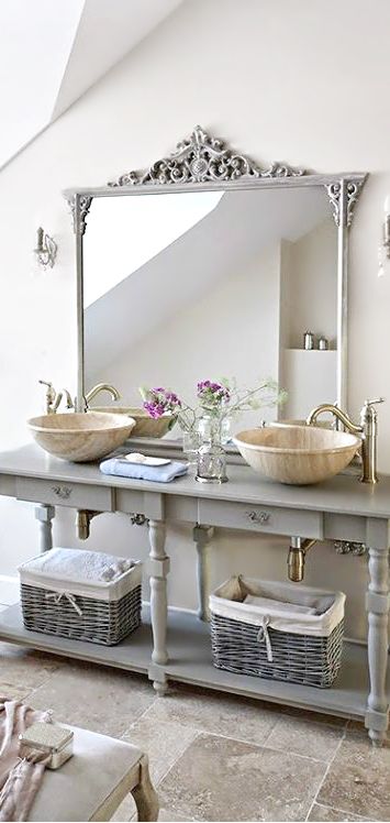 light grey bathroom vanity with open shelving and baskets