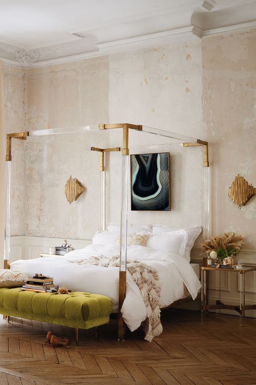 Lucite canopy bed frame with metallic touches looks jaw dropping