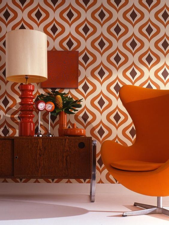 Orange and brown geo mid century modern wallapaper and corresponding furniture