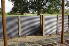 27 corrugated metal sheet fence with wooden posts