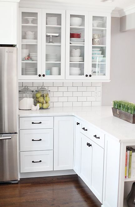 farmhouse white kitchen with white subway tiles and counters