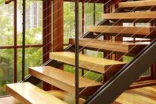 27 open modern staircase with wood, metal and cable railings and light-colored steps