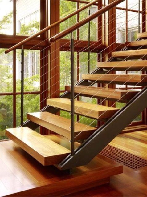 open modern staircase with wood, metal and cable railings and light-colored steps