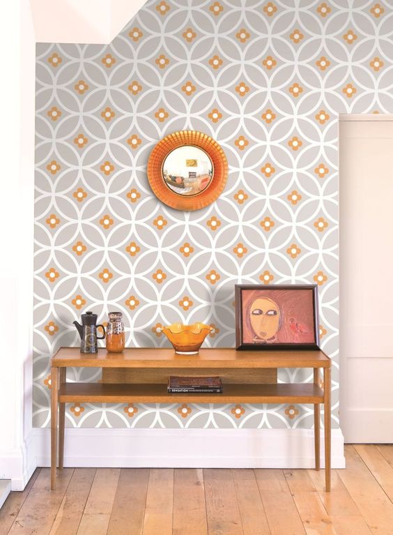 orange and grey wallpaper with a geometric print for an entryway