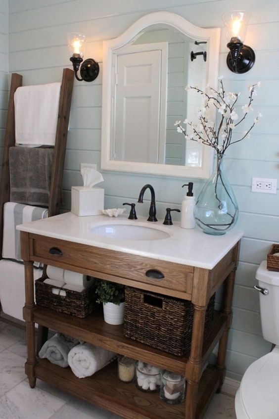 rustic wood bathroom vanity with open shelving and a drawer, a white counter