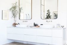 29 modern white floating vanity with a marble top