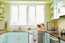29 sunny yellow walls and mint painted cabinets make this kitchen warm and inviting