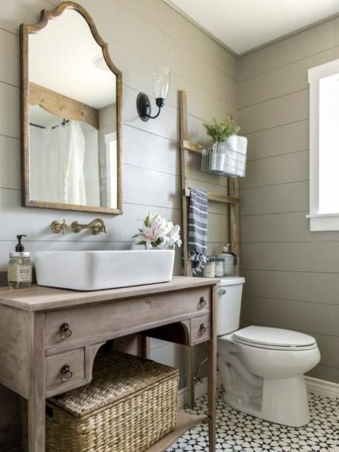 vintage whitewashed bathroom vanity with an open shelf and some drawers can be DIYed