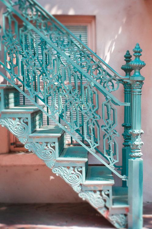 gorgeous blue-painted iron stairs and railing with a unique pattern