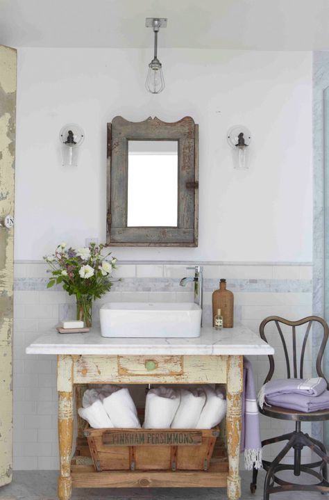 shabby reclaimed wood vanity with a drawer and an open shelf and a modern counter