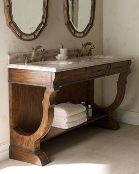 vintage rustic bathroom vanity with a stone countertop with an open shelf