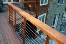 36 outdoor deck with warm-wood posts, cable railings