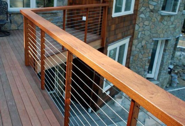 outdoor deck with warm-wood posts, cable railings