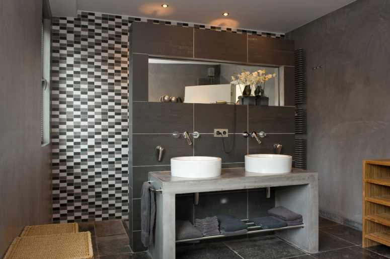 This minimalist contemporary gray bathroom looks great with an industrial vanity. (De Heren van Sfeer bvba Geert-Jan Maillé)