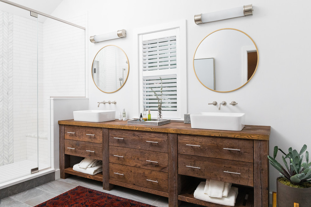 This double reclaimed wood vanity features lots of spacious drawers and looks amazing by a pure white wall. (Cummings Architects)