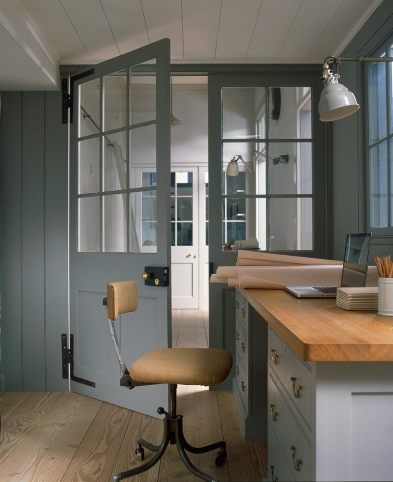 a loft style home office with glass panel doors (Plain English)