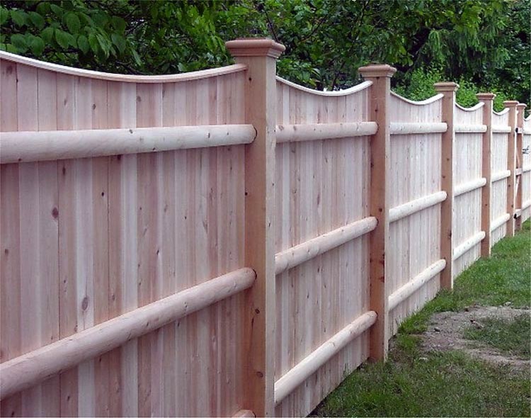 A solid fence with capped scalloped top and three doweled backing rails for strength is a super sturdy solution. (AVO Fence & Supply, Inc.)