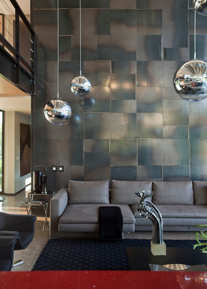 a large wall of this family room is covered with steel cladding (Nico van der Meulen Architects)