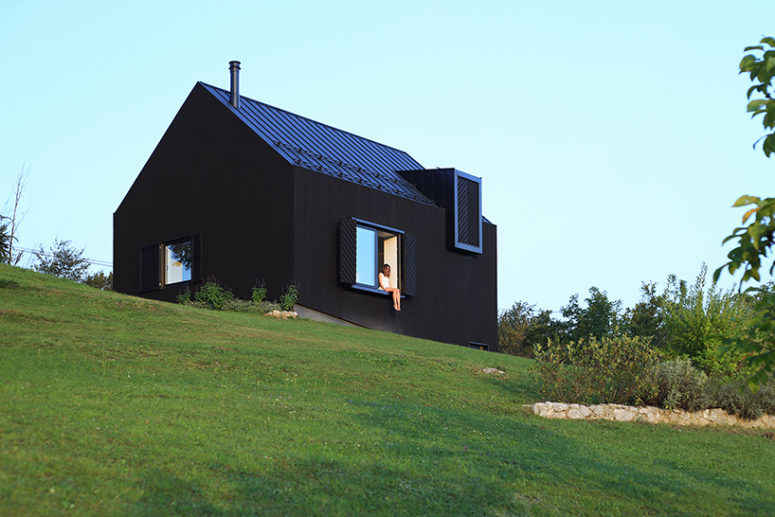 This black wood house in Croatia is designed to reduce heat losses and for better ventilation