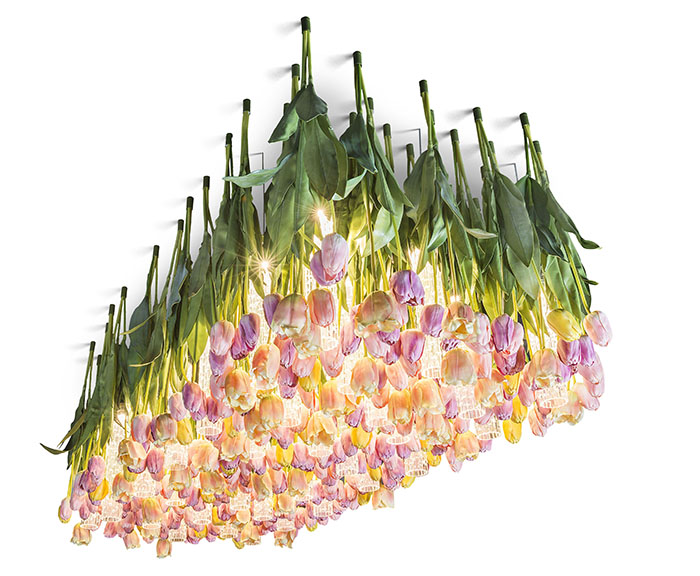 This impressive Flower Power chandelier was inspired by spring and it features a lot of faux tulips in tender pastel colors