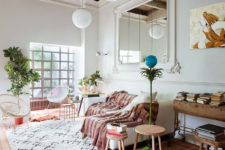 01 This mid-century modern apartment is located in Spain but decorated with soft Parisian vibes