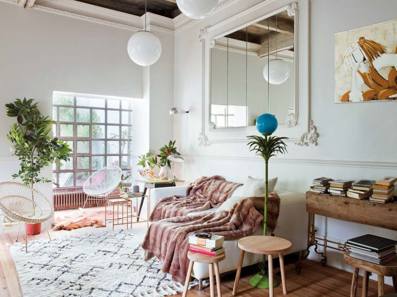 This mid century modern apartment is located in Spain but decorated with soft Parisian vibes