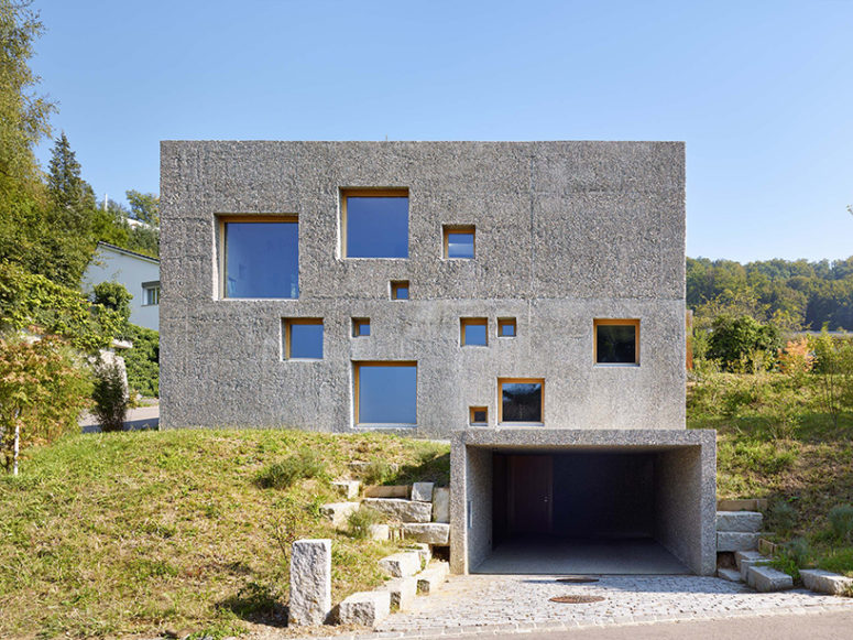 Modern Concrete House Puntured With Square Windows