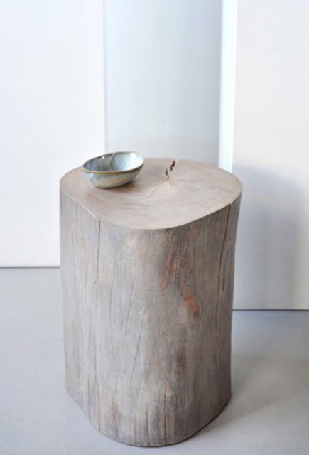 A usual tree stump turned into a shabby-inspired side table and stool at the same time