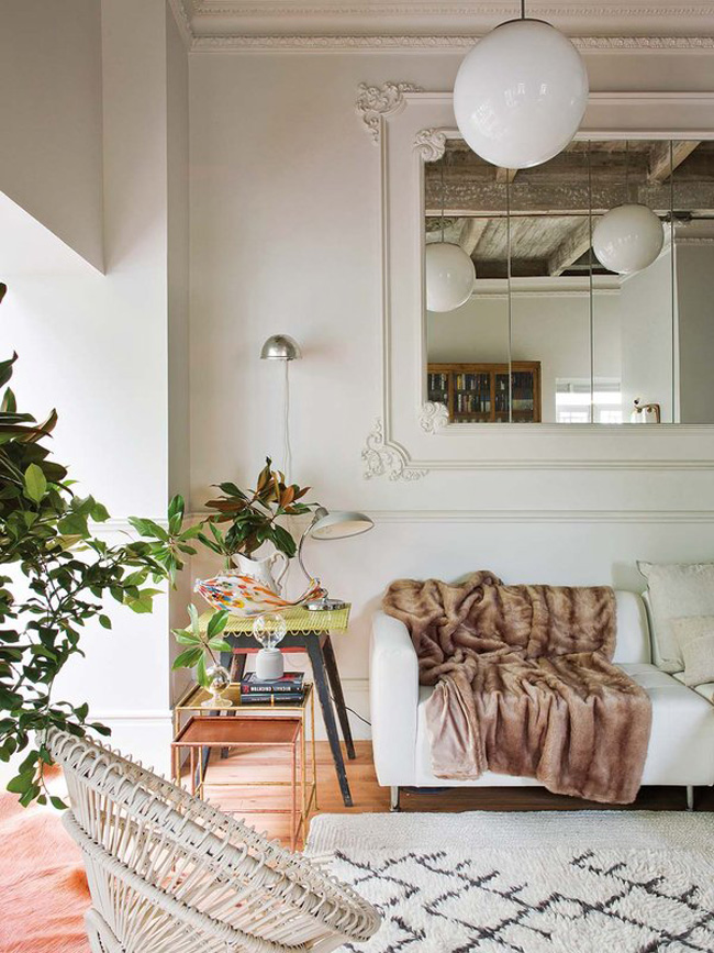 Soft textiles make the space inviting, and greenery enlivens it