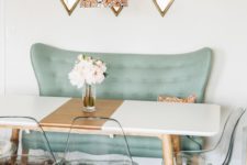 02 a color blocked dining table in black and copper with wooden legs looks cute with acrylic chairs and a mint love seat