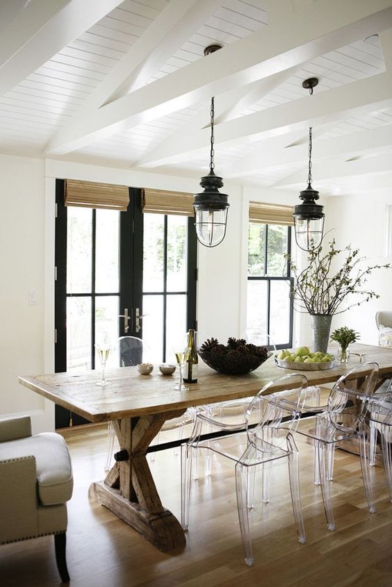a cozy rustic dining space with acrylic chairs