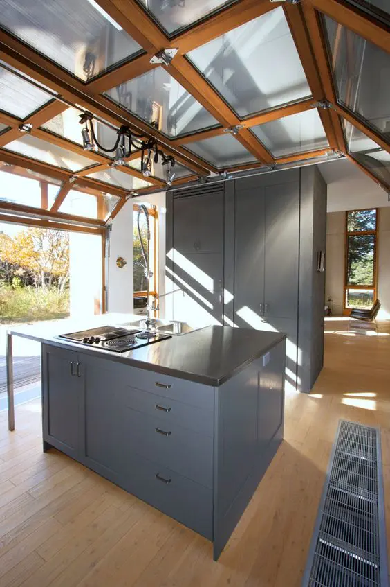 modern kitchen with a roll up garage door to enjoy the views whole cooking and eating