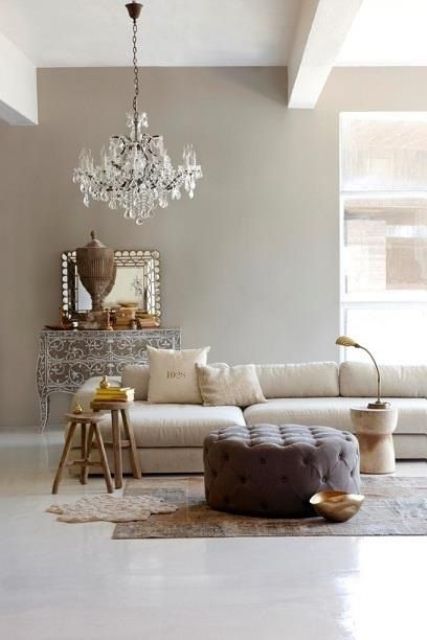 French style living room with a modern twist and a vintage glam chandelier for a refined feel