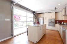 03 install a glass garage door for a bright, open-air kitchen