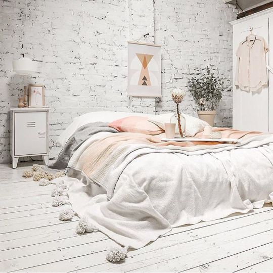 no matter how your bed looks, sometimes soft pastel and off-white bedding with tassels is enough