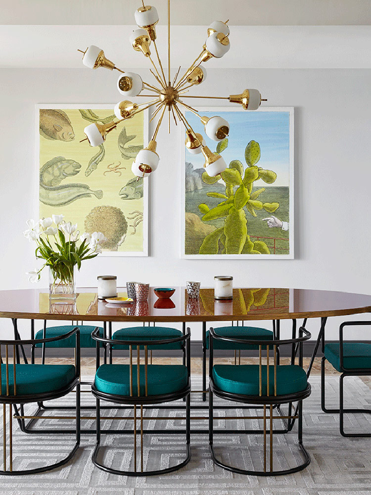 Emerald chairs and a mid century modern chandelier create a style in the dining space, and artworks create a mood