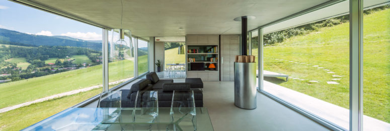 The inside of the home is open plan, with lots of modern materials used - metal, glass, acryl
