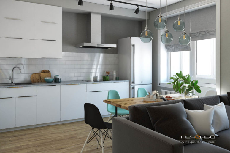 The living, dining space and the kitchen are united into an open layout space filled with light