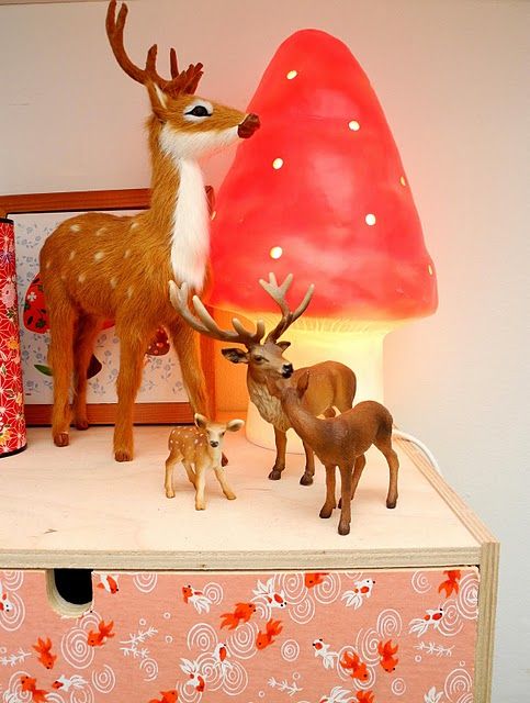 a cute mushroom table lamp and a deer composition for a woodland room