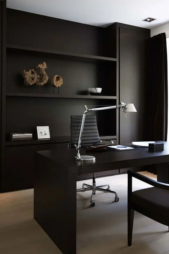 a minimalist dark stained open wooden desk with no storage