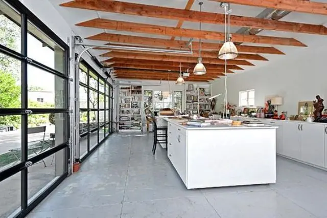 roll up garage doors for a kitchen bring much light in and serve as a door