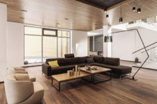 05 The living room is centered around an L-shaped sectional and a pair of coffee tables