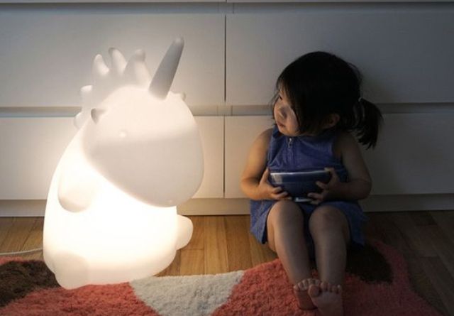 a giant unicorn table lamp will excite kids and adults too