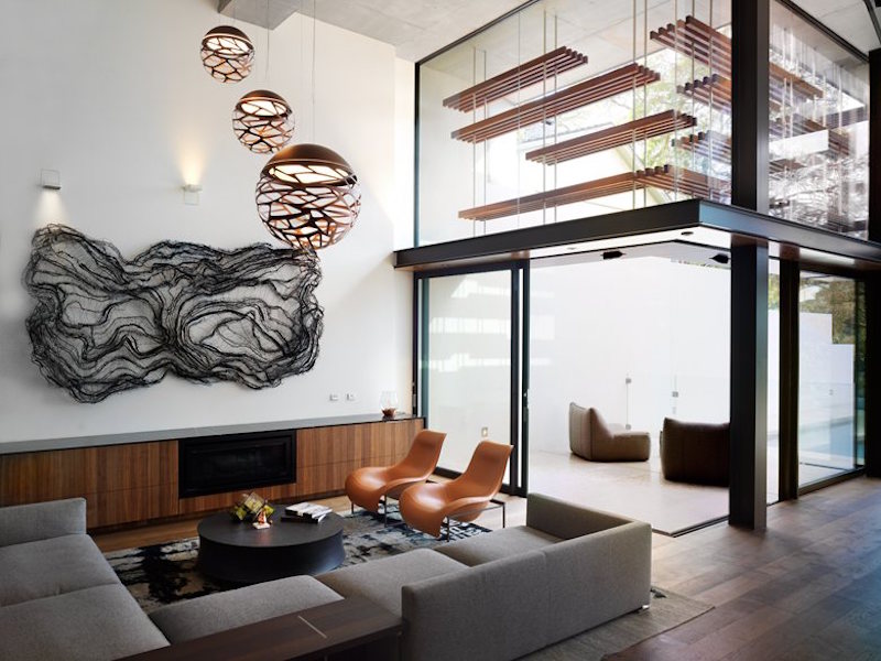 I love the open spaces inside, with elegant copper details and sculptural elements