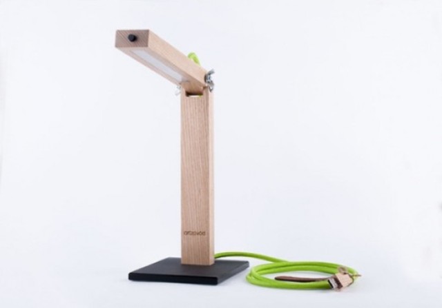 Minimalist home office table lamp made of light colored wood and LEDs