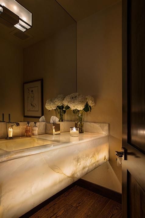 refined and luxurious lit up marble bathroom vanity