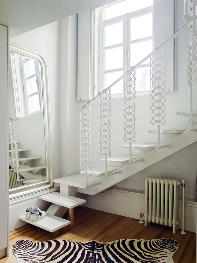 White is actually wide used in this apartment, and it expands the space